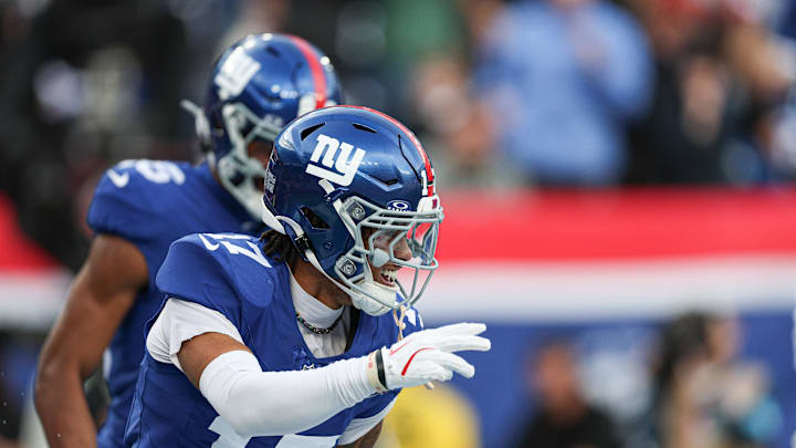 Dec 29, 2024; East Rutherford, New Jersey, USA; New York Giants wide receiver Wan'Dale Robinson (17) celebrates his touchdown reception during the first half against the Indianapolis Colts at MetLife Stadium.   