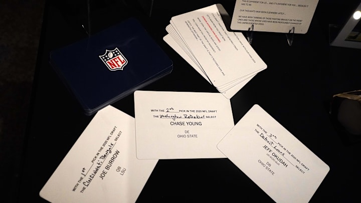 Apr 28, 2021; Canton, Ohio, USA; The draft cards of the top three picks in the 2020 NFL Draft of the top three picks, Joe Burrow (Cincinnati Bengals), Chase Young (Washington Redskins) and Jeff Okudah (Detroit Lions) on display at the Pro Football Hall of Fame. Apr 28, 2021; Canton, Ohio, USA; The draft cards of the top three picks in the 2020 NFL Draft of the top three picks, Joe Burrow (Cincinnati Bengals), Chase Young (Washington Redskins) and Jeff Okudah (Detroit Lions) on display at the Pro Football Hall of Fame.