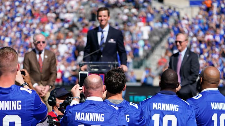 Eli Manning's teammates wear his jersey during the Ring of Honor ceremony at MetLife Stadium on Sunday, Sept. 26, 2021, in East Rutherford. 