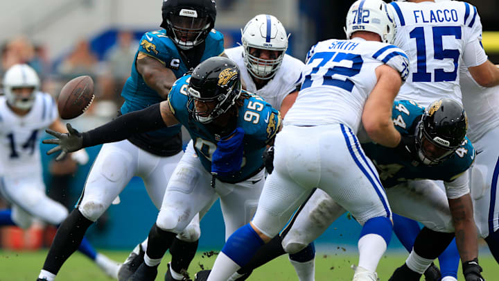 A fumble turnover slips through the hands of Jacksonville Jaguars defensive tackle Roy Robertson-Harris (95) during the second quarter of an NFL football matchup Sunday, Oct. 6, 2024 at EverBank Stadium in Jacksonville, Fla.  