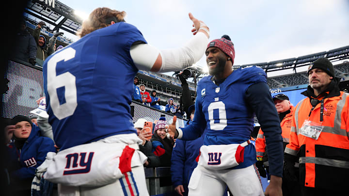 Jan 4, 2026; East Rutherford, New Jersey, USA; New York Giants linebacker Brian Burns (0) greets New York Giants quarterback Jaxson Dart (6) after the game against the Dallas Cowboys at MetLife Stadium.  