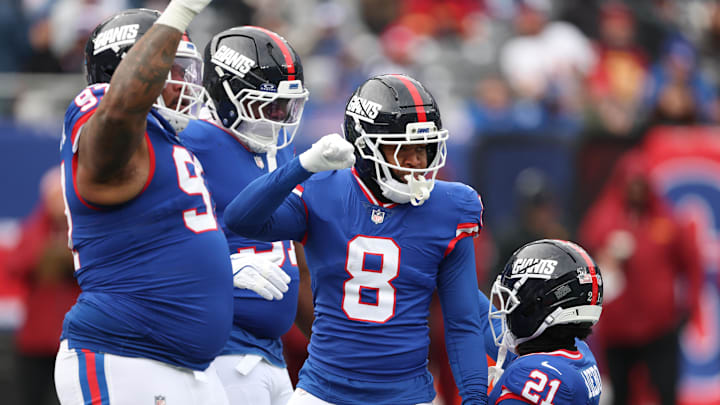 Dec 14, 2025; East Rutherford, New Jersey, USA;  New York Giants safety Jevon Holland (8) reacts after defensive stop during the first quarter against the Washington Commanders at MetLife Stadium.  
