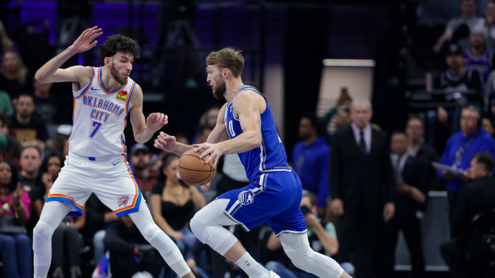 Nov 10, 2023; Sacramento, California, USA; Sacramento Kings forward Domantas Sabonis (10) drives to the basket against Oklahoma City Thunder forward Chet Holmgren (7) during the first quarter at Golden 1 Center. Mandatory Credit: Sergio Estrada-USA TODAY Sports