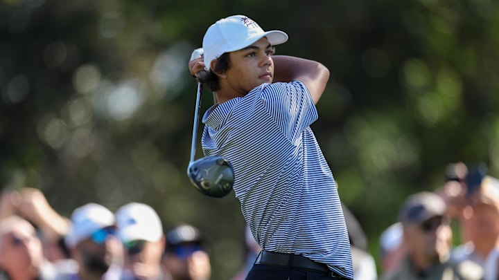 Dec 21, 2024; Orlando, Florida, [USA]; Charlie Woods tees on on the sixth hole during the PNC Championship at The Ritz-Carlton Golf Club. Mandatory Credit: Nathan Ray Seebeck-Imagn Images