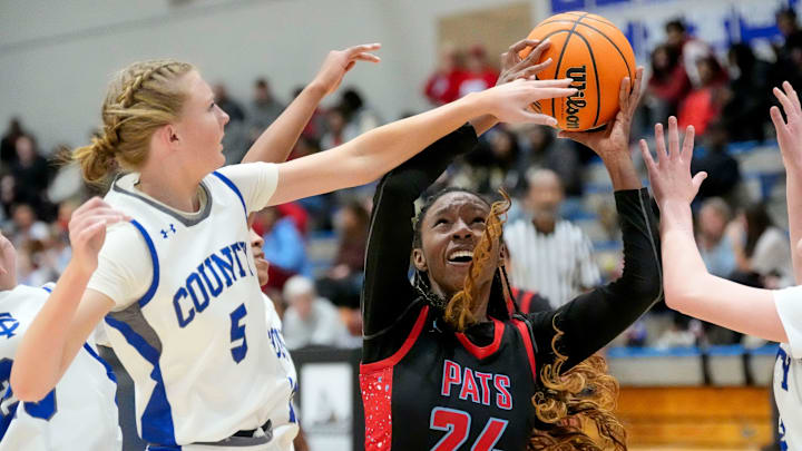 Jan 28, 2025; Northport, AL, USA; Tuscaloosa County forward Brylee Myrick (5) defends a shot by Hillcrest guard Jareah Branch (24) at Tuscaloosa County High School.