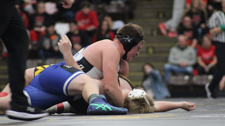 Dundee's Abe Bruck wrestles Ogemaw Heights' Ethan Hock at 285 pounds in the MHSAA Division 3 team state wrestling quarterfinals at the Wings Event Center in Kalamazoo.