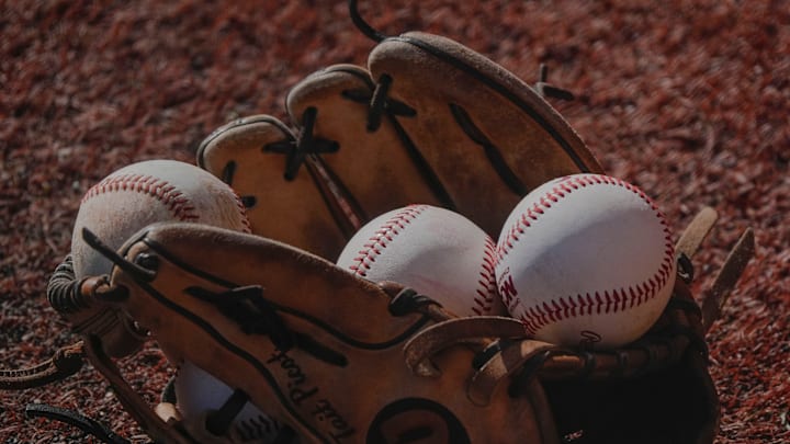 Feb 25, 2025; Tuscaloosa, AL, USA; Baseballs lie in a glove at Sewell-Thomas Stadium.