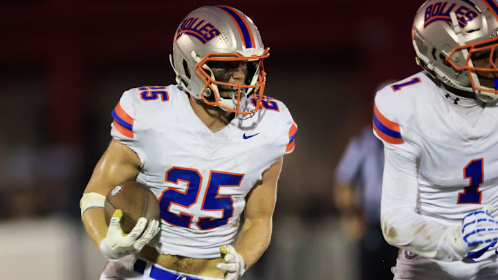 Bolles' Xander Edwards (25) rushed for over 500 yards and eight touchdowns in the Bulldogs' 73-49 win over the Baldwin Indians. His eight touchdowns broke Derrick Henry's single-game rushing touchdown record when the NFL superstar was enrolled at Yulee. 