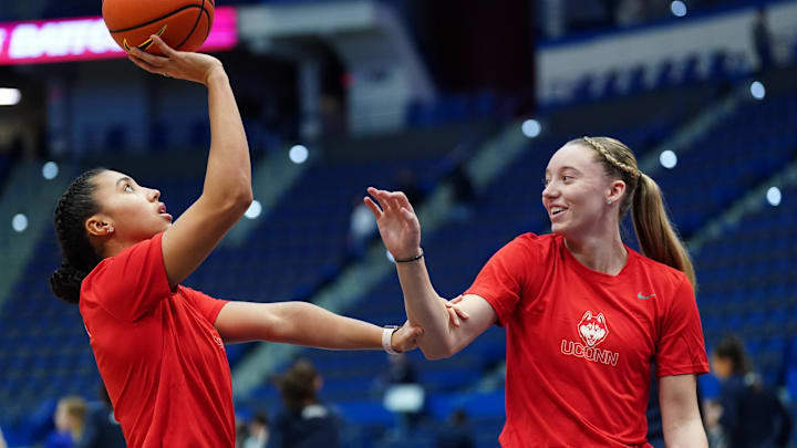 Dec 21, 2022; Hartford, Connecticut, USA; UConn Huskies guard Azzi Fudd (35) and guard Paige Bueckers (5) on the court as their teammates warm up before the start of the game against the Seton Hall Pirates at XL Center. Mandatory Credit: David Butler II-Imagn Images Dec 21, 2022; Hartford, Connecticut, USA; UConn Huskies guard Azzi Fudd (35) and guard Paige Bueckers (5) on the court as their teammates warm up before the start of the game against the Seton Hall Pirates at XL Center. Mandatory Credit: David Butler II-Imagn Images