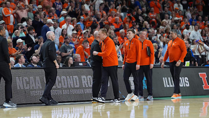 Mar 21, 2026; Greenville, SC, USA; Illinois Fighting Illini head coach Brad Underwood and VCU Rams head coach Phil Martelli Jr. shake hands after the game during a second round game of the men's 2026 NCAA Tournament at Bon Secours Wellness Arena. Mandatory Credit: Jim Dedmon-Imagn Images
