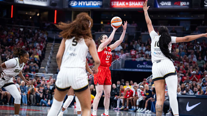 May 17, 2025; Indianapolis, Indiana, USA; Indiana Fever guard Caitlin Clark (22) shoots the ball while Chicago Sky center Kamilla Cardoso (10)  defends in the first half at Gainbridge Fieldhouse. Mandatory Credit: Trevor Ruszkowski-Imagn Images