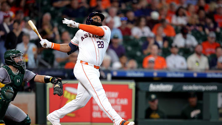 Sep 12, 2024; Houston, Texas, USA; Houston Astros first baseman Jon Singleton (28) hits a double to left field against the Oakland Athletics during the second inning at Minute Maid Park. Mandatory Credit: Erik Williams-Imagn Images