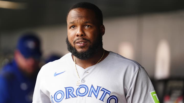Aug 6, 2025; Denver, Colorado, USA; Toronto Blue Jays first base Vladimir Guerrero Jr. (27) reacts from the dugout in the fifth inning against the Colorado Rockies at Coors Field. Mandatory Credit: Ron Chenoy-Imagn Images
