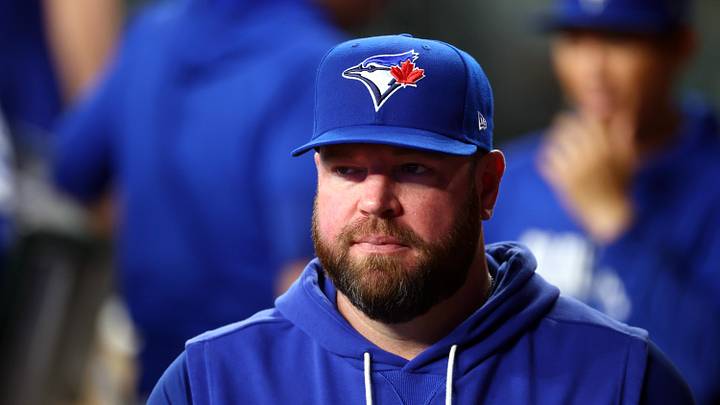 Toronto Blue Jays manager John Schneider looks on.