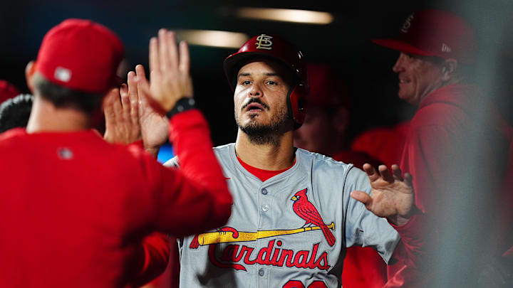 Sep 24, 2024; Denver, Colorado, USA; St. Louis Cardinals third base Nolan Arenado (28) celebrates with teammates after scoring in the eighth inning against the Colorado Rockies at Coors Field. Mandatory Credit: Ron Chenoy-Imagn Images Sep 24, 2024; Denver, Colorado, USA; St. Louis Cardinals third base Nolan Arenado (28) celebrates with teammates after scoring in the eighth inning against the Colorado Rockies at Coors Field. Mandatory Credit: Ron Chenoy-Imagn Images
