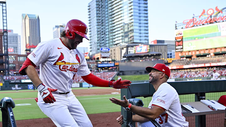 Jul 28, 2025; St. Louis, Missouri, USA;  St. Louis Cardinals designated hitter Alec Burleson (41) celebrates with manager Oliver Marmol (37) after hitting a solo home run against the Miami Marlins during the third inning at Busch Stadium. Mandatory Credit: Jeff Curry-Imagn Images