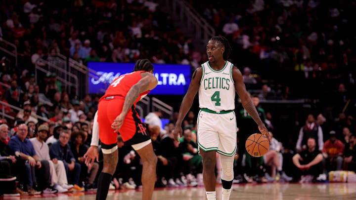 Jan 3, 2025; Houston, Texas, USA; Boston Celtics guard Jrue Holiday (4) handles the ball against Houston Rockets guard Jalen Green (4) during the third quarter at Toyota Center. Mandatory Credit: Erik Williams-Imagn Images