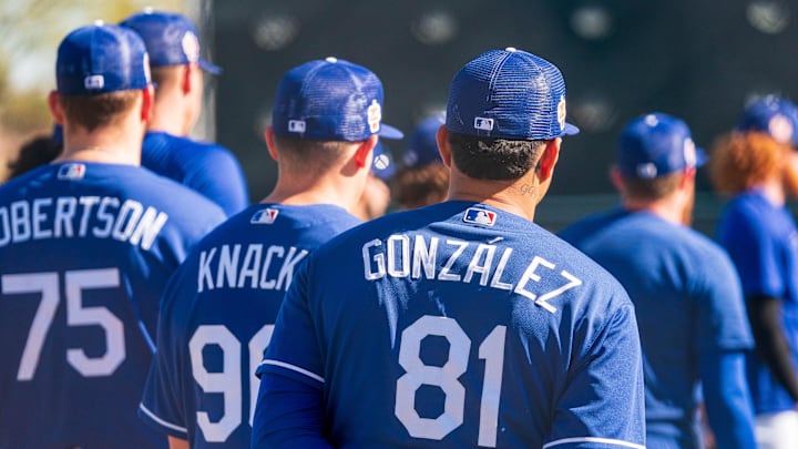 Feb 20, 2023; Glendale, AZ, USA; Los Angeles Dodgers players including pitcherVictor Gonzalez (81) and pitcher Landon Knack (96) and pitcher Nick Robertson (75) look on during a spring training workout at Camelback Ranch. Feb 20, 2023; Glendale, AZ, USA; Los Angeles Dodgers players including pitcherVictor Gonzalez (81) and pitcher Landon Knack (96) and pitcher Nick Robertson (75) look on during a spring training workout at Camelback Ranch.