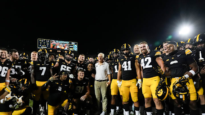 Iowa Hawkeyes head coach Kirk Ferentz celebrates with his players after becoming the winningest coach in Big Ten history, passing Woody Hayes, with a win over the Massachusetts Minutemen Sept. 13, 2025 at Kinnick Stadium in Iowa City, Iowa. Iowa Hawkeyes head coach Kirk Ferentz celebrates with his players after becoming the winningest coach in Big Ten history, passing Woody Hayes, with a win over the Massachusetts Minutemen Sept. 13, 2025 at Kinnick Stadium in Iowa City, Iowa.