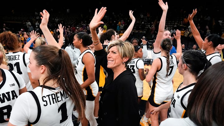 Iowa head coach Jan Jensen and her team wave to the Hawkeye fans Oct. 30, 2025 after defeating the Ashland Eagles in an exhibition game at Carver-Hawkeye Arena in Iowa City, Iowa. Iowa head coach Jan Jensen and her team wave to the Hawkeye fans Oct. 30, 2025 after defeating the Ashland Eagles in an exhibition game at Carver-Hawkeye Arena in Iowa City, Iowa.