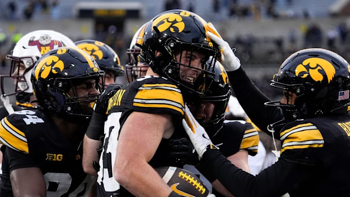 Teammates congratulate Iowa Hawkeyes linebacker Cam Buffington (33) after he intercepted a pass during a game against the Minnesota Golden Gophers Oct. 25, 2025 at Kinnick Stadium in Iowa City, Iowa.
