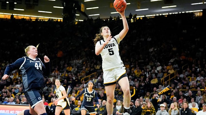Iowa center Ava Heiden (5) drives to the basket against the Penn State Nittany Lions Dec. 28, 2025 at Carver-Hawkeye Arena in Iowa City, Iowa.