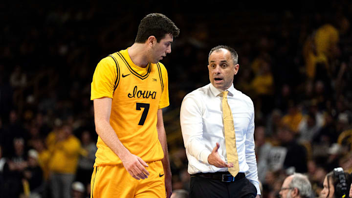 Iowa head coach Ben McCollum instructs Iowa forward Alvaro Folgueiras (7) during a basketball game against the Ohio State Buckeyes Feb. 25, 2026 at Carver-Hawkeye Arena in Iowa City, Iowa. Iowa head coach Ben McCollum instructs Iowa forward Alvaro Folgueiras (7) during a basketball game against the Ohio State Buckeyes Feb. 25, 2026 at Carver-Hawkeye Arena in Iowa City, Iowa.