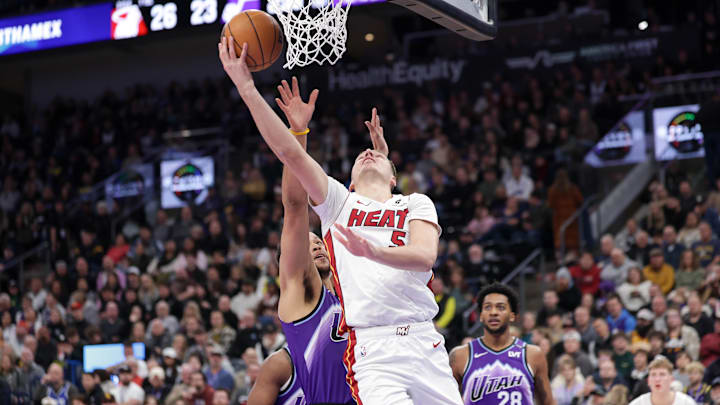 Jan 24, 2026; Salt Lake City, Utah, USA;  Miami Heat forward Nikola Jović (5) gets past Utah Jazz forward/guard Kyle Anderson (2) and to the basket during the first quarter at Delta Center. Mandatory Credit: Chris Nicoll-Imagn Images