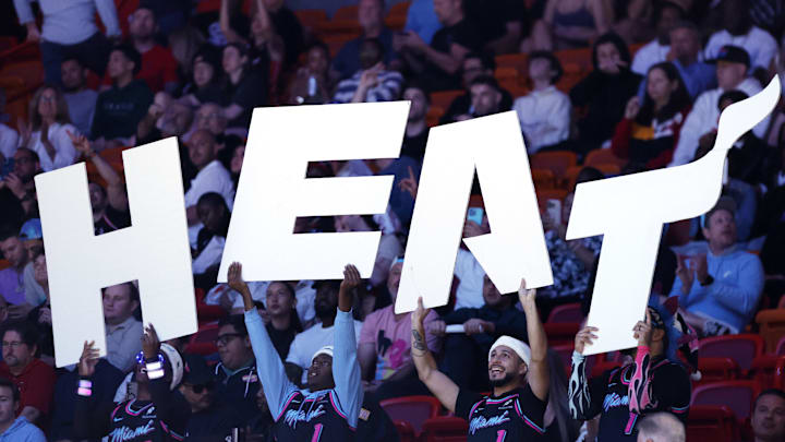Dec 6, 2025; Miami, Florida, USA;  Member of the Miami Heat entertainment team, the Hoop Troop, hold a Heat sign against the Sacramento Kings during the second half at Kaseya Center. Mandatory Credit: Rhona Wise-Imagn Images