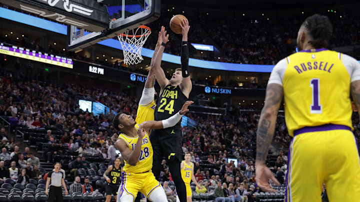 Feb 14, 2024; Salt Lake City, Utah, USA;  Utah Jazz center Walker Kessler (24) tries shoot the ball past Los Angeles Lakers forward Anthony Davis (3) and forward Rui Hachimura (28) during the second half at Delta Center. Mandatory Credit: Chris Nicoll-Imagn Images