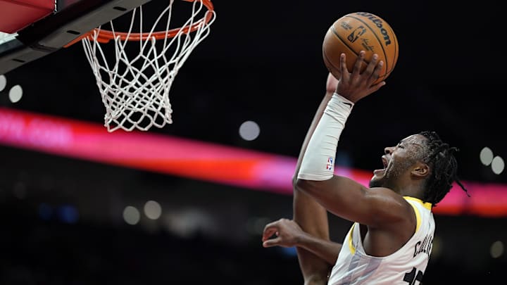 Dec 6, 2024; Portland, Oregon, USA; Utah Jazz guard Isaiah Collier (13) drives to the basket under pressure from Portland Trail Blazers forward Jabari Walker (34, behind) during the second half at Moda Center. Mandatory Credit: Soobum Im-Imagn Images