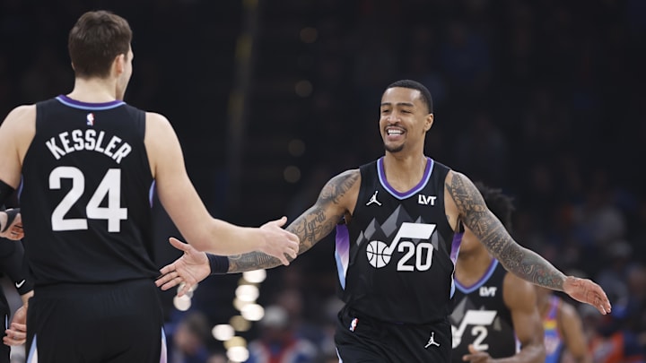 Jan 22, 2025; Oklahoma City, Oklahoma, USA; Utah Jazz forward John Collins (20) celebrates with Utah Jazz center Walker Kessler (24) after scoring against the Oklahoma City Thunder during the first quarter at Paycom Center. Mandatory Credit: Alonzo Adams-Imagn Images