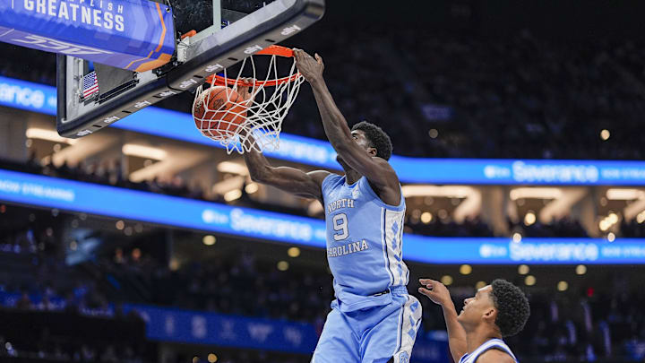 Mar 14, 2025; Charlotte, NC, USA; North Carolina Tar Heels guard Drake Powell (9) with a dunk against the Duke Blue Devils during the first half at Spectrum Center. Mandatory Credit: Jim Dedmon-Imagn Images