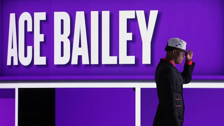 Jun 25, 2025; Brooklyn, NY, USA; Ace Bailey looks on after being selected as the fifth pick by the Utah in the first round of the 2025 NBA Draft at Barclays Center. Mandatory Credit: Brad Penner-Imagn Images Jun 25, 2025; Brooklyn, NY, USA; Ace Bailey looks on after being selected as the fifth pick by the Utah in the first round of the 2025 NBA Draft at Barclays Center. Mandatory Credit: Brad Penner-Imagn Images