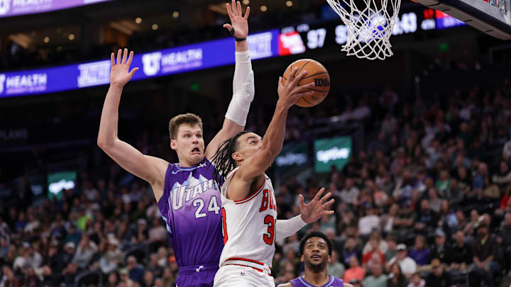 Mar 17, 2025; Salt Lake City, Utah, USA; Chicago Bulls guard Tre Jones (30) gets past Utah Jazz center Walker Kessler (24) and to the basket during the second half at Delta Center. Mandatory Credit: Chris Nicoll-Imagn Images Mar 17, 2025; Salt Lake City, Utah, USA; Chicago Bulls guard Tre Jones (30) gets past Utah Jazz center Walker Kessler (24) and to the basket during the second half at Delta Center. Mandatory Credit: Chris Nicoll-Imagn Images