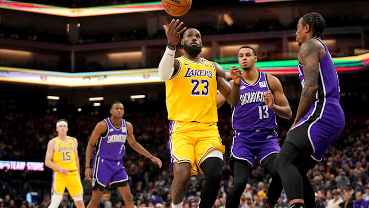 Dec 19, 2024; Sacramento, California, USA; Los Angeles Lakers forward LeBron James (23) loses control of the ball next to Sacramento Kings forward Keegan Murray (13) in the first quarter at the Golden 1 Center. Mandatory Credit: Cary Edmondson-Imagn Images