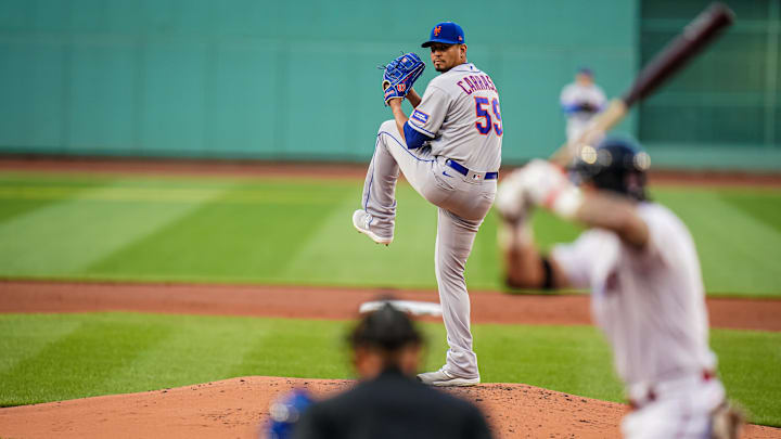 Jul 23, 2023; Boston, Massachusetts, USA; New York Mets starting pitcher Carlos Carrasco (59) throws a pitch against the Boston Red Sox in the first inning at Fenway Park. Mandatory Credit: David Butler II-Imagn Images