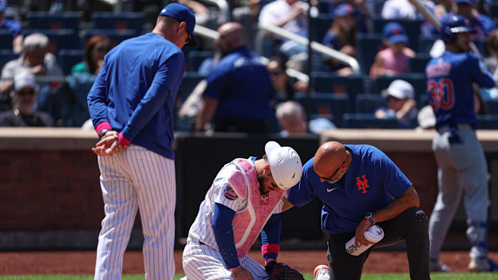 May 11, 2025; New York City, New York, USA; New York Mets catcher Luis Torrens (13) is looked at by medical staff after being hit by a foul ball by Chicago Cubs right fielder Kyle Tucker (not pictured) during the sixth inning at Citi Field. Torrens would leave the game due to an injury after the play. Mandatory Credit: Vincent Carchietta-Imagn Images May 11, 2025; New York City, New York, USA; New York Mets catcher Luis Torrens (13) is looked at by medical staff after being hit by a foul ball by Chicago Cubs right fielder Kyle Tucker (not pictured) during the sixth inning at Citi Field. Torrens would leave the game due to an injury after the play. Mandatory Credit: Vincent Carchietta-Imagn Images