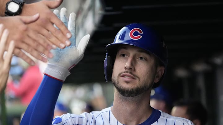 Oct 2, 2025; Chicago, Illinois, USA; Chicago Cubs outfielder Kyle Tucker (30) is greeted in the dugout after scoring against the San Diego Padres during game three of the Wildcard round for the 2025 MLB playoffs at Wrigley Field. Mandatory Credit: David Banks-Imagn Images