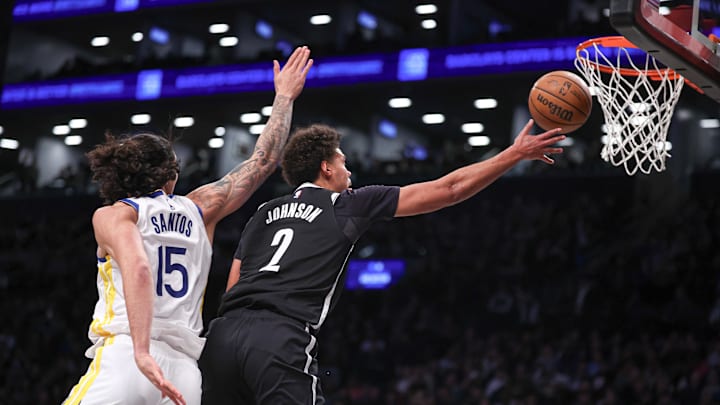 Feb 5, 2024; Brooklyn, New York, USA; Brooklyn Nets forward Cameron Johnson (2) lays the ball as Golden State Warriors forward Gui Santos (15) defends during the first half at Barclays Center. Mandatory Credit: Vincent Carchietta-Imagn Images Feb 5, 2024; Brooklyn, New York, USA; Brooklyn Nets forward Cameron Johnson (2) lays the ball as Golden State Warriors forward Gui Santos (15) defends during the first half at Barclays Center. Mandatory Credit: Vincent Carchietta-Imagn Images