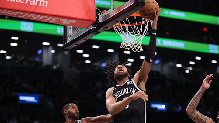 Feb 7, 2025; Brooklyn, New York, USA; Brooklyn Nets forward Trendon Watford (9) goes to the basket against Miami Heat forward Haywood Highsmith (24) during the first quarter at Barclays Center. Mandatory Credit: Vincent Carchietta-Imagn Images