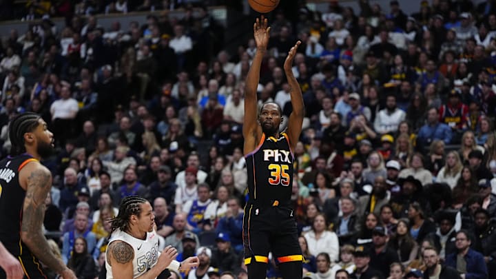 Mar 7, 2025; Denver, Colorado, USA; Phoenix Suns forward Kevin Durant (35) shoots the ball over Denver Nuggets forward Aaron Gordon (32) in the second quarter at Ball Arena. Mandatory Credit: Ron Chenoy-Imagn Images