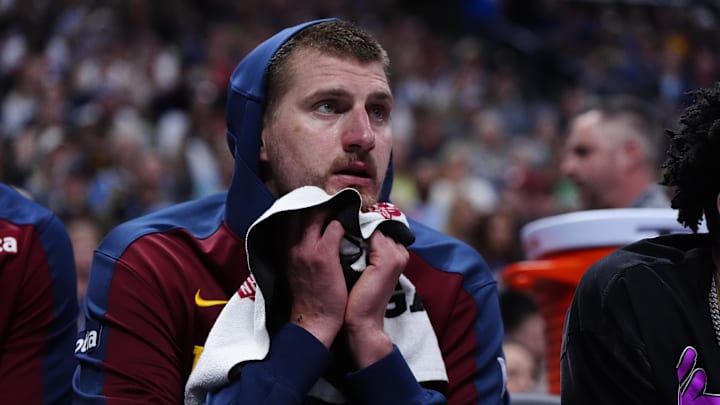 May 3, 2025; Denver, Colorado, USA; Denver Nuggets center Nikola Jokic (15) reacts from the bench in the third quarter against the LA Clippers during game seven of first round for the 2025 NBA Playoffs at Ball Arena. Mandatory Credit: Ron Chenoy-Imagn Images