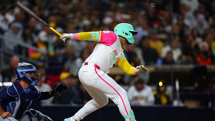 Apr 25, 2025; San Diego, California, USA; San Diego Padres left fielder Tirso Ornelas (21) singles to record his first career MLB hit during the fifth inning against the Tampa Bay Rays at Petco Park. 