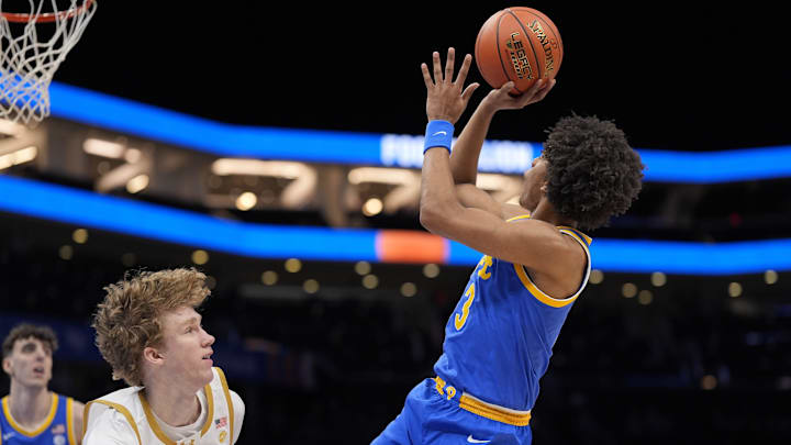 Mar 11, 2025; Charlotte, NC, USA; Pittsburgh Panthers guard Brandin Cummings (3) shoots while defended by Notre Dame Fighting Irish forward Garrett Sundra (12) during the first half at Spectrum Center. Mandatory Credit: Jim Dedmon-Imagn Images