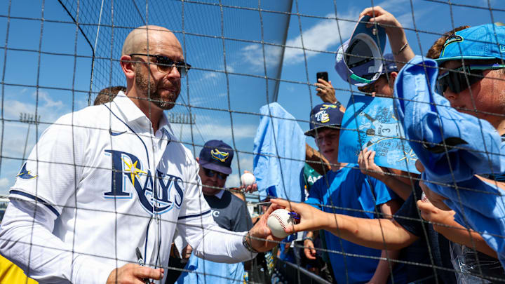 Former Tampa Bay third baseman Evan Longoria signs autographs for fans Saturday in Tampa, on the day he retired as a Ray. Former Tampa Bay third baseman Evan Longoria signs autographs for fans Saturday in Tampa, on the day he retired as a Ray.
