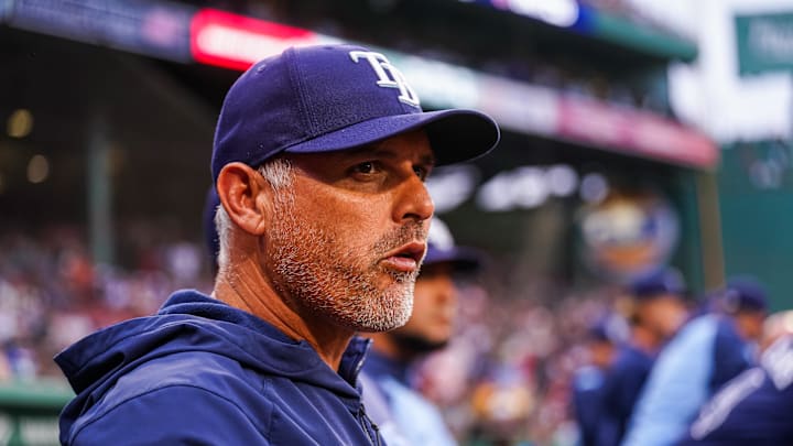 Tampa Bay Rays manager Kevin Cash (16) watches from the dugout against the Boston Red Sox in the first inning at Fenway Park. Tampa Bay Rays manager Kevin Cash (16) watches from the dugout against the Boston Red Sox in the first inning at Fenway Park.