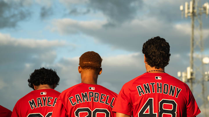 Boston's top-three prospects in Marcelo Mayer, Kristian Campbell and Roman Anthony stand for the national anthem ahead of a Spring Training breakout game on March 13, 2025.