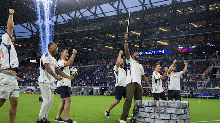 Aug 1, 2024; Cincinnati, Ohio, USA; Cincinnati Reds starting pitcher Hunter Greene participates in the sword ceremony before the match between Queretaro FC and FC Cincinnati at TQL Stadium. Mandatory Credit: Katie Stratman-Imagn Images