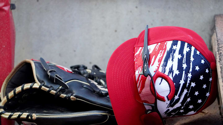 Cincinnati Reds left fielder Tommy Pham  s (28) glove and hat rest on the dugout steps during the first inning of a baseball game against the New York Mets, Monday, July 4, 2022, at Great American Ball Park in Cincinnati.

New York Mets At Cincinnati Reds July 1 0018